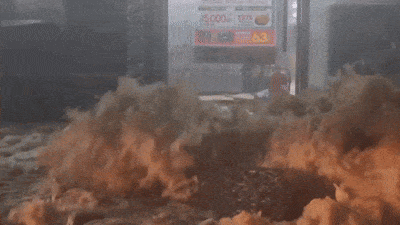 A manhole cover is lifted by record-breaking rainfall in Muan, South Jeolla Province, as recorded in a Facebook post by provincial councilor Na Gwang-guk. (Facebook)
