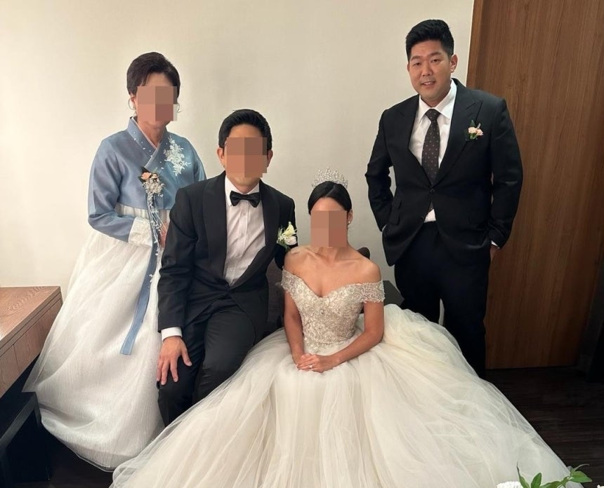 Tae-heung Kim (far right), who is being detained by US immigration authorities, is seen in a photo taken at his brother’s wedding. (The National Korean American Service & Education Consortium)