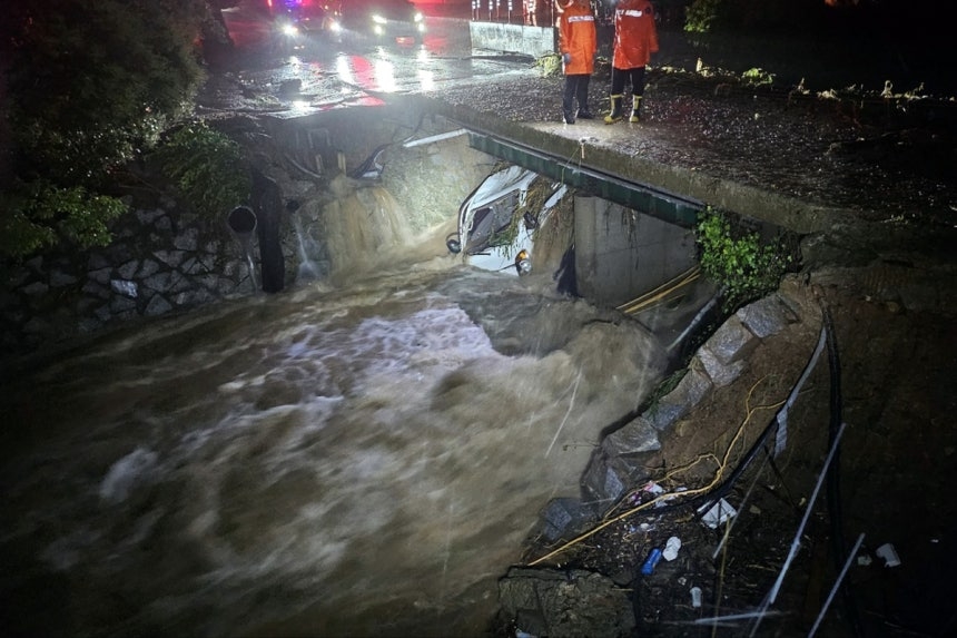 A 1-ton truck swept away by floodwaters is submerged in a stream in Cheonggye-myeon of Muan, South Jeolla Province, Sunday, when the area was hit by a torrential downpour of up to 142.1 millimeters per hour. (Yonhap)