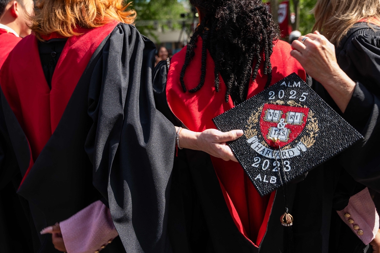 Graduating students gather in Harvard Yard on May 28, 2025, in Boston, Massachusetts, as the Trump administration intensifies its fight with the nation's oldest and one of the world's wealthiest universities. His administration asked federal agencies on Tuesday to cancel contracts with Harvard University valued at approximately $100 million. (Spencer Platt/Getty Images/AFP)